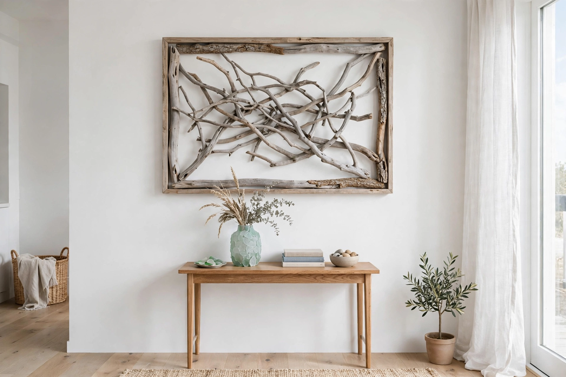 White wall with large driftwood branch art in natural wood frame above console table