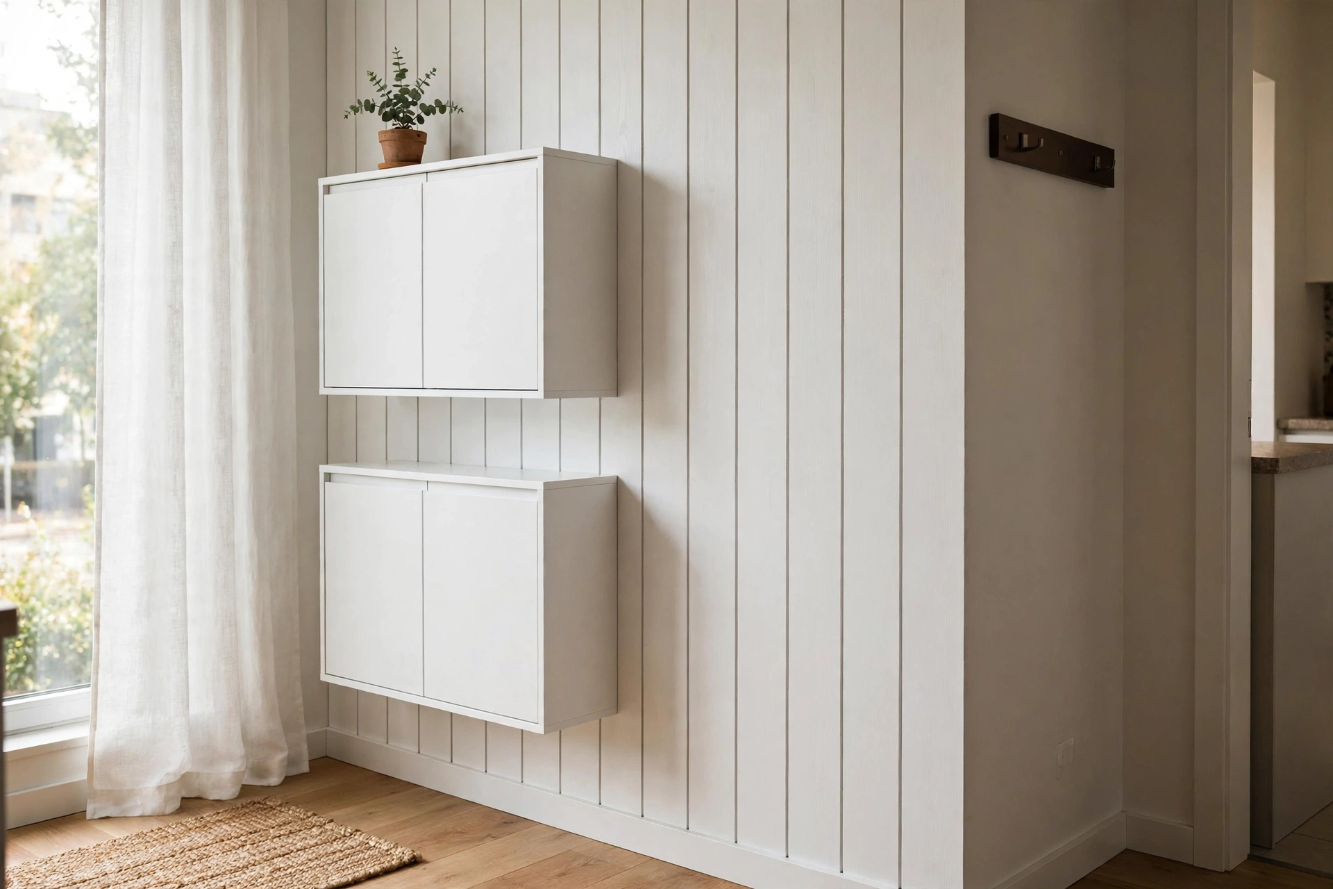 Slim wall-mounted shoe cabinet blending into a studio entryway wall