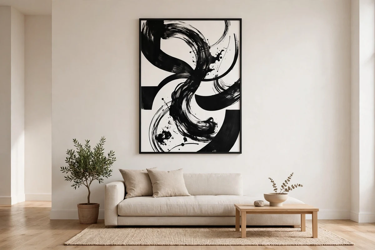 Single oversized monochrome artwork on a minimalist living room wall
